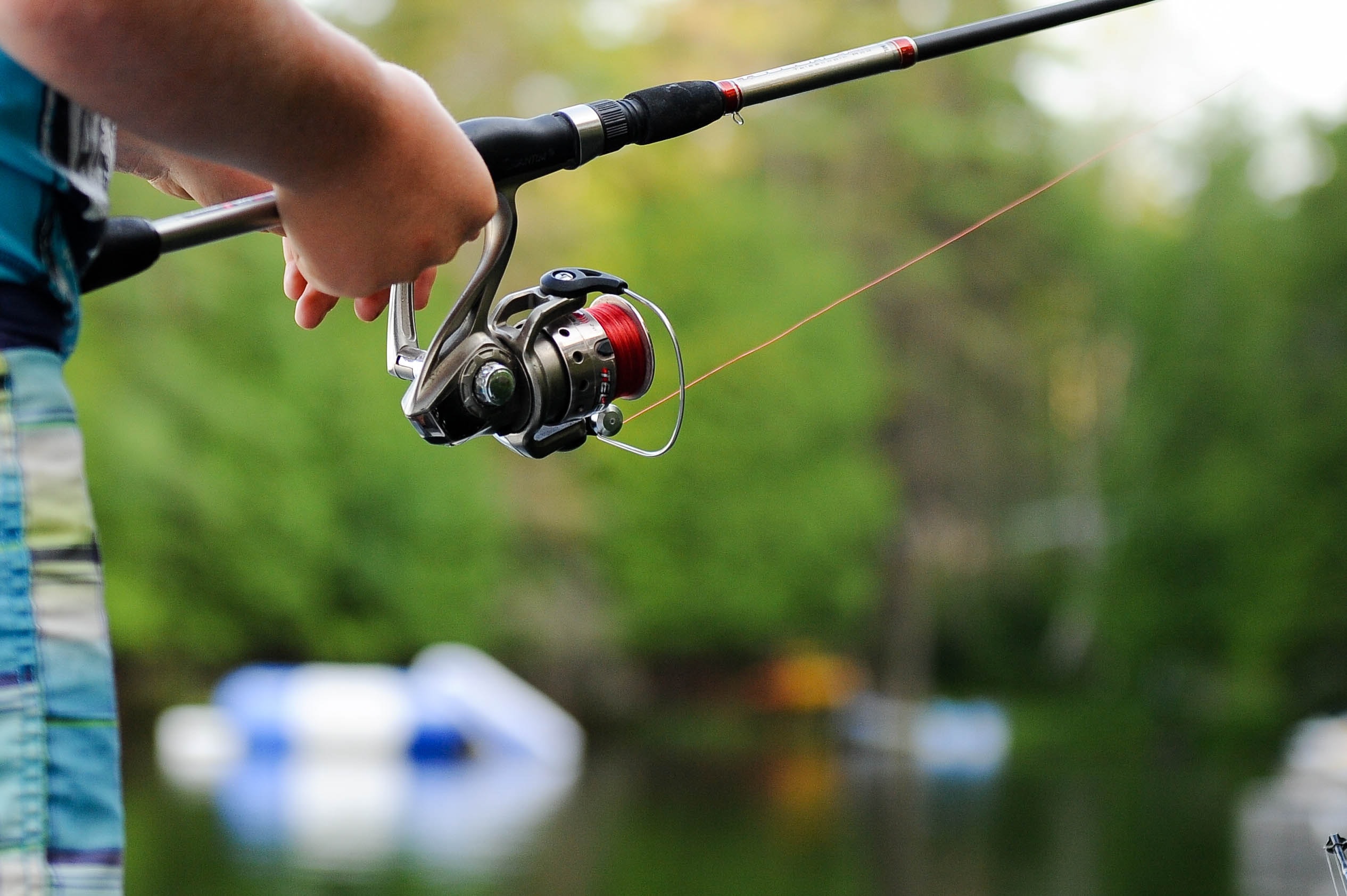 person holding fishing reel